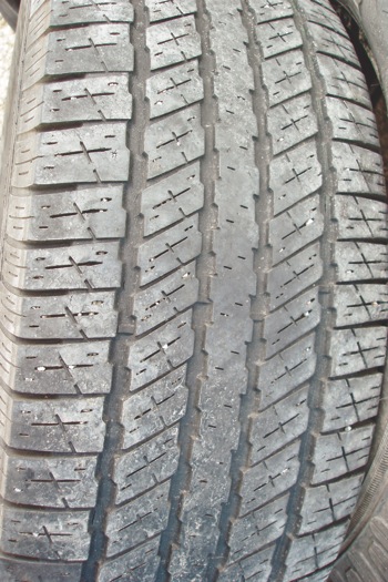 photo 1: although this tire is worn slightly at the center from over-inflation, the tread is worn evenly with no feathering at the edges of the tread ribs.