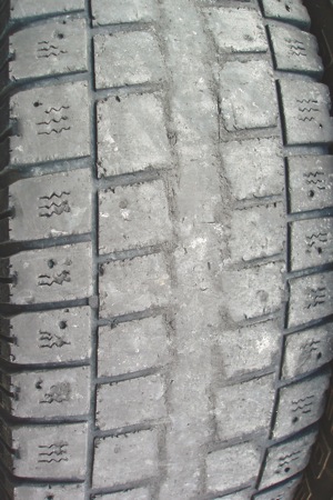 photo 4: since the outside tread ribs are largely intact, this tire has obviously suffered from over-inflation.