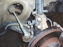 photo 3: an imaginary line drawn from the center of the rear axle through the tie rod end should closely intersect with the steering knuckle pivot point.