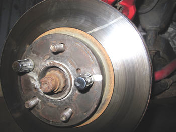before the rotor is removed, make sure you mark its position on the flange. if the runout is small, try repositioning the rotor 180º on the flange to cancel out the runout.