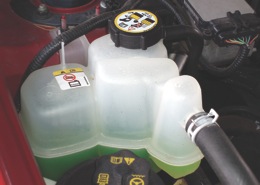 photo 3: a clean reservoir containing clear coolant usually indicates that the cooling system is in good condition. 