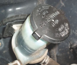 Photo 6: Power steering fluid should be changed periodically to help reduce steering gear and pump wear. 