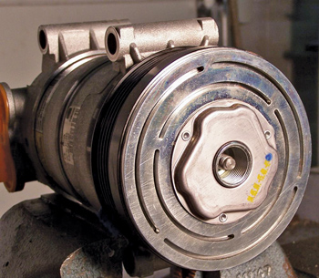 two styles of compressor clutches where a traditional spanner wrench cannot be used.