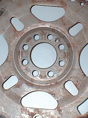 figure 3: upon close inspection of this flexplate, a crack can be seen forming around the center section of the plate. once the crack makes it all the way around, actual crank position in the center can shift compared to the outside. if the ckp tone ring is utilized on the outer portion of the flexplate, measured crankshaft position will be incorrect. 
