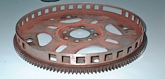 figure 4: the tone ring can be a part of the flexplate. this flexplate features signature notches to quickly identify engine position. 