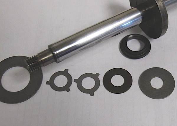 here is where most of the wear occurs in a shock or strut. these small discs of metal are mounted on the shaft and are held in place with either a nut or a nut and spring. as the piston moves, the discs deflect and fluid moves between the two chambers. even under normal conditions on a smooth road, shocks stroke on average 1,750 times for every mile traveled. the action causes a “shearing” action on the fluid that is not unlike what motor oil is subjected to when it is between engine bearings. this action can break down the base oil and additive package. the wear on the fluid can change the viscosity of the fluid and make the unit  unable to dampen suspension movement. the discs and springs in the valves can also suffer from metal fatigue due to the constant movement of the suspension and the passing of the fluid. 