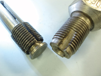 photo 4: expanding collet and conventional spark plug thread chasers are handy for cleaning or restoring the spark plug threads in the cylinder head.