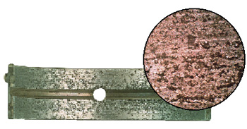figure 3: this aluminum bearing was damaged by embedment of glass beads. inset photo shows the extent of the damage. (courtesy of federal-mogul)