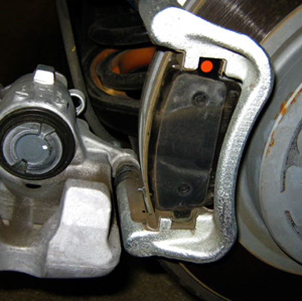turn the rear brake piston to retract the piston. go the opposite way the parking park lever pulls. the torque spec for the caliper pin bolts is a torque spec of 27 n·m (20 ft/lbs). 