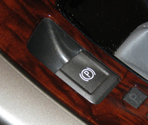 to release the parking brake, turn the ignition switch to on, press the brake pedal, and push down momentarily on the electric parking brake switch. when the parking brake is released, the red brake light turns off. if the red park brake light is flashing on the dash, the electric parking brake may be only partially applied or released, or there is a problem with the electric parking brake. the center display will read “service park brake.” the system on the lacrosse does not automatically engage when the vehicle is parked. 