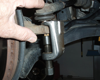 photo 1: a tie rod ­removal tool prevents damaging the threads on the tie rod stud and tearing the tie rod dust boot during removal.