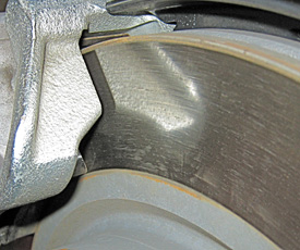 brake friction material deposited on rotor.