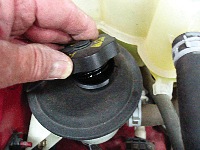 photo 2: always begin an under-hood inspection by checking power steering fluid level, color and viscosity.