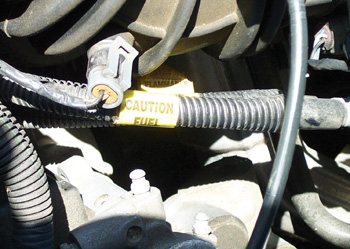 If fuel pressure is less than specifications, the problem might be an  obstructed or leaking fuel line. 