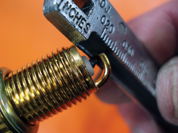 improper handling can easily damage electrodes plated with precious metals. always use the correct tools to adjust spark plug gap.