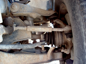 photo 4: notice that the tie rod operates in about the same geometric plane as the upper and lower control arms on this torsion bar-equipped vehicle.