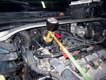 Photo 10: To get a complete fill on the cooling system, use a vacuum-type system to test and fill.