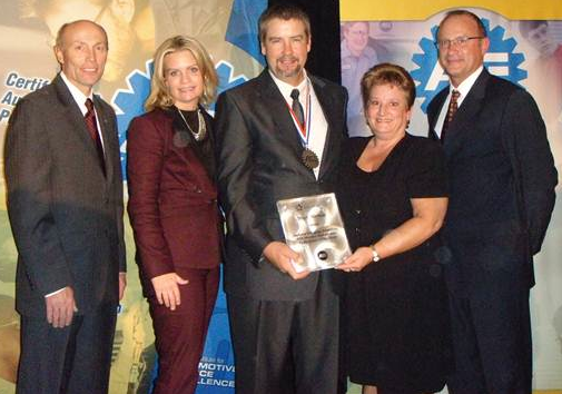 From Left t to Right: Tim Zilke, President, ASE; Kristen Davis, Director, Delmar; Mark Herman, ASE Master Automobile Technician of the Year; his wife Janet Herman; and Greg Clayton, Vice President, Delmar.