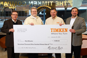Leaders from The Timken Company’s Automotive and Heavy-Duty Aftermarket team presented Rick Wheeler (second from left) with a check for the actual cash value of a Harley-Davidson Heritage Softail Classic, the grand prize in the 2009 “Where you Turn for Easy Ridin’” Sweepstakes. Presenters included (from left) Mike Peace, national sales manager; Tom Tecklenburg, director; and J. Barry Harris, manager – global products and marketing.