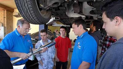 agoura high automotive technology instructor, john anderson, (left) works with students at the agoura hills, ca, high school. here he is working with dylan landy (blue shirt at right) on an exhaust project. students dylan landy and evan weller just took fifth place nationally in an auto technology competition. (dean musgrove/staff photographer)