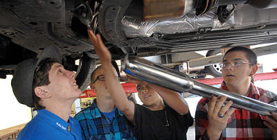 agoura high automotive technology student evan weller, (left) works with other students on an auto exhaust project at the agoura hills, ca, high school. students dylan landy and evan weller just took fifth place nationally in an auto technology competition. (dean musgrove/staff photographer)