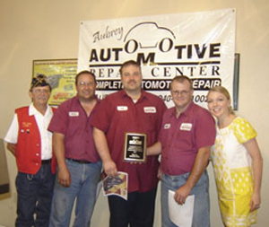 John Whitley, commander of Disabled American Veterans Denton Memorial Chapter 106, left, and Denise Brown, Unit 106 DAV Auxiliary commander, visited Aubrey Automotive Repair Center recently to say thank you. They are shown with, from left, mechanic Monty Huckabee and shop owners Gary Bigley and Bill Cogswell.