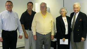 (L to R):   Ray Wiedman and Carl Tellier, Tenneco; Paul Sechrist, Mary Sechrist and Tom Sechrist, owners of Motown Automotive